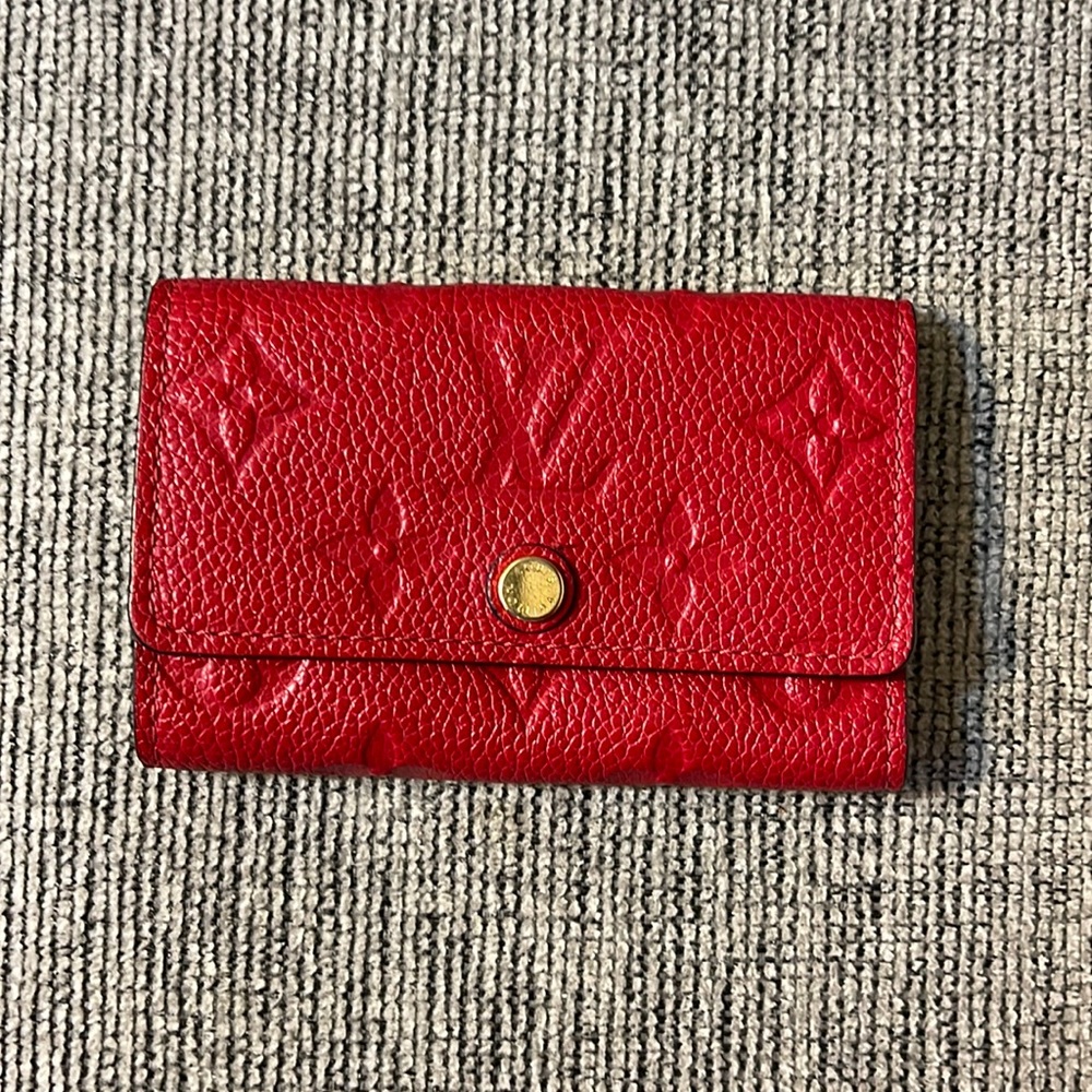 Louis Vuitton Monogram Empreinte leather to the 6-Key Holder.